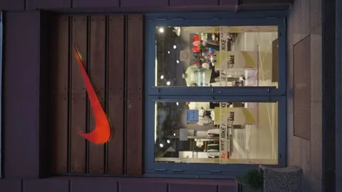 Vertical shot of Nike Logo on a front store. Minsk, Belarus - October 1, 2024 Stock Footage 286264005