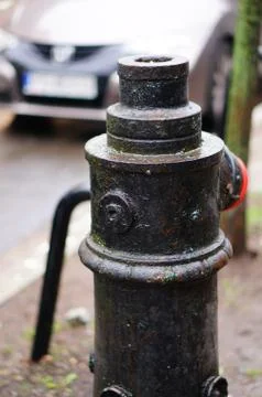 Vertical shot of an old fire hydrant on the sidewalk 스톡 사진