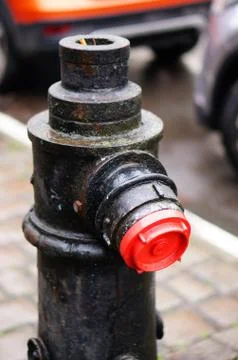 Vertical shot of an old fire hydrant on the sidewalk 스톡 사진