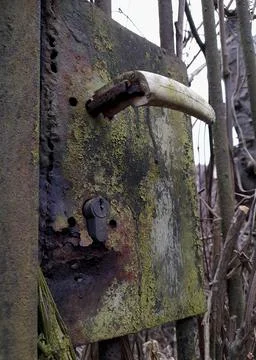 Vertical shot of an old rusty door handle Photos