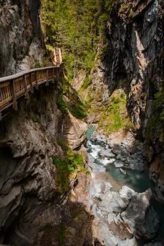 Vertical shot of path in Gorner Gorge with river Stock Photos