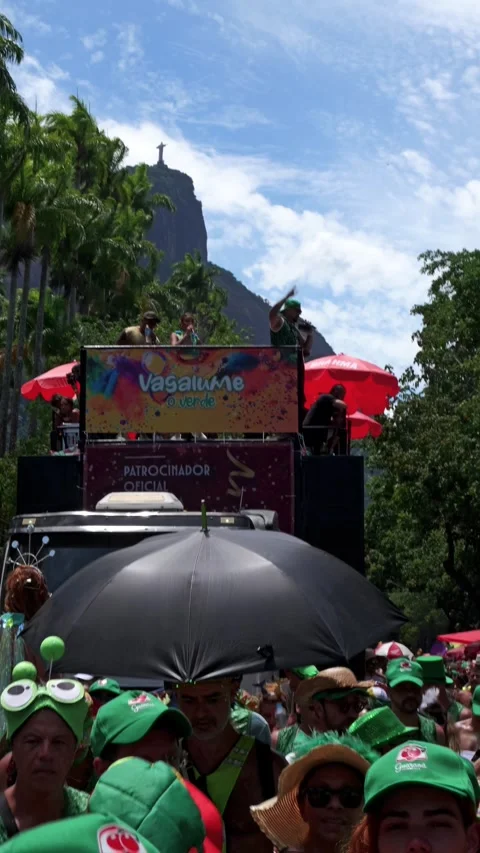 Vertical shot of people dancing around a parade truck near Jardim Botânico Stock Footage 337410599
