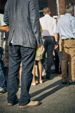 A vertical shot of people standing in the queue for a pub's rush hour in Dubl Stock Photos