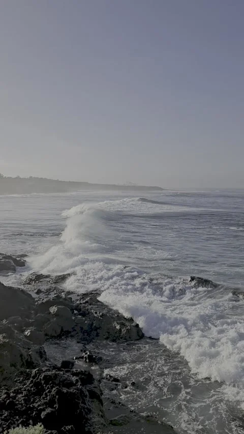 Vertical shot of powerful Atlantic ocean waves crashing against volcanic rock Stock Footage 332424524