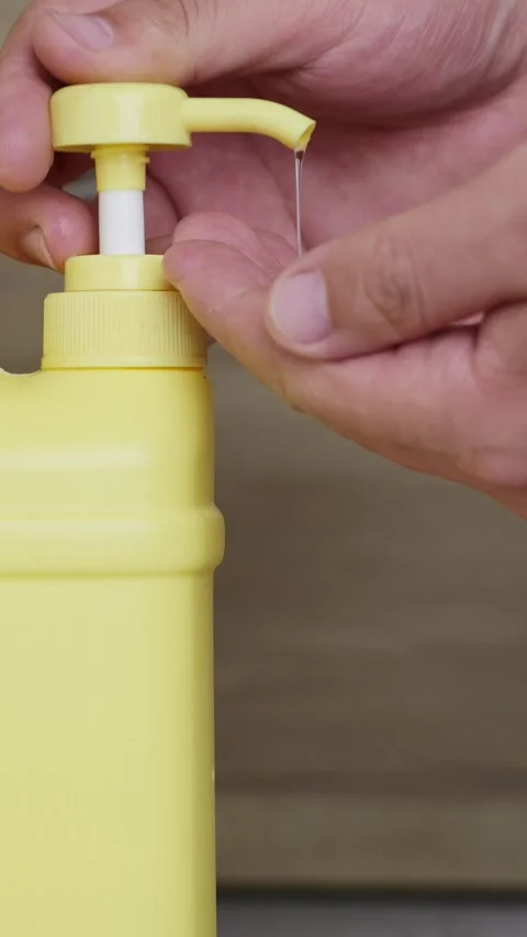 Vertical shot: Press liquid dispenser bottle. Stock Footage 344831626
