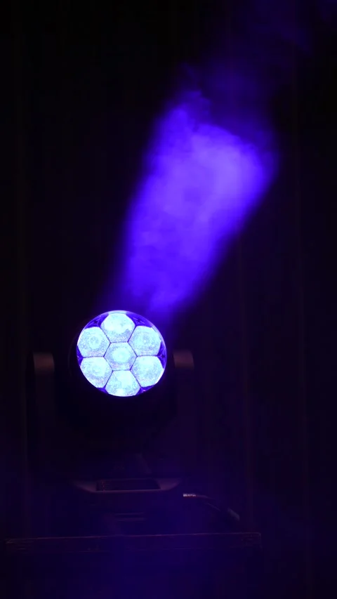 Vertical shot of purple LED stage spotlight beam through smoke Stock Footage 346348297