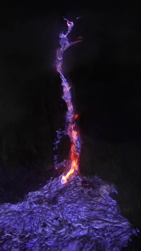 Vertical shot of the renowned blue flame phenomenon at Kawah Ijen, East Java Stock Footage 313633812