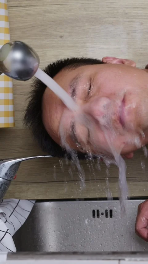 Vertical shot: Rinse eyes with tap water. Stock Footage 344831643