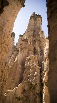 A vertical shot of the rock formations of Djavolja Varos located in Serbia du Stock Photos