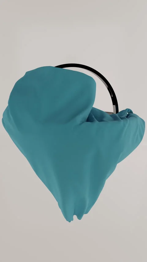 Vertical shot of rotating black rings on grey background with falling blue cloth Stock Footage 242517472