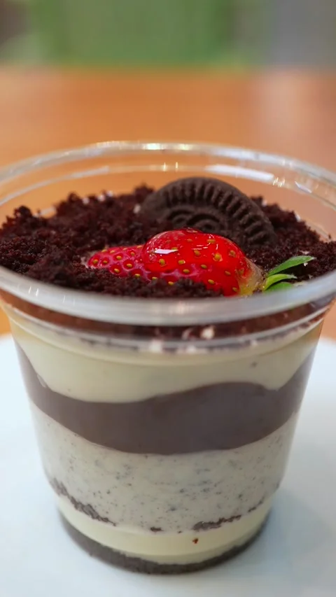 Vertical Shot Rotating Magnolia Dessert with Strawberry Cream and Biscuit L.. Stock Footage 332182452