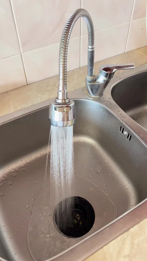 Vertical Shot. Running kitchen faucet for plumbing service promo and repair.. Stock Footage 338189850