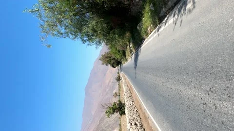Vertical shot running in the middle of the track at sunny day in the high mounta Stock Footage 199546548