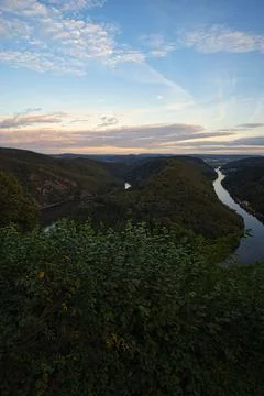 Vertical shot of the Saar loop in Saarland under a cloudy evening sky Foto stock