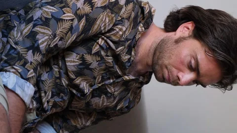 Vertical shot of sad man on the sofa Stock Footage 278103657