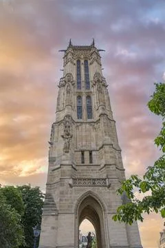 Vertical shot of the the Saint-Jacques tower under a sunset sky in Paris, France Stock Photos