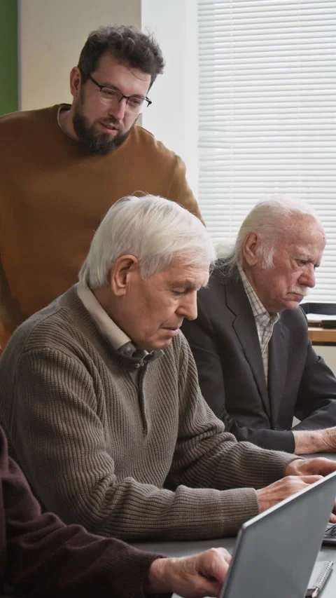 Vertical Shot of Senior People using Internet in Computer Literacy Class Stock Footage 333710854