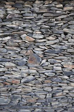 Vertical shot of slate wall texture and background .   stone wall texture Stock Photos