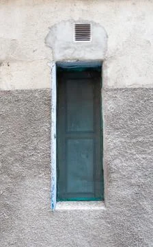 Vertical shot of a small window of an aged building in Garganta la Olla, Spai Stock Photos