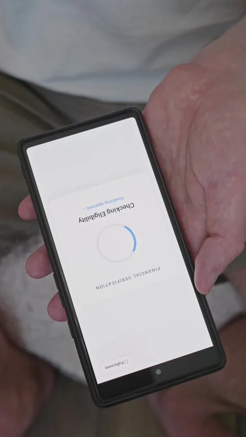 Vertical shot of smartphone screen showing loan approval message with credit Stock Footage 341860787