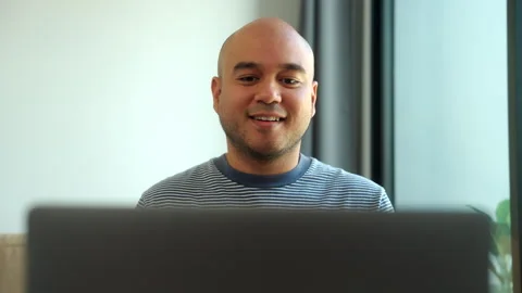 Vertical shot smiling young deaf asian man talking to friend with video call usi Stock Footage 299867919