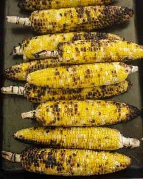 Vertical shot of a stack of grilled corns Stock Photos