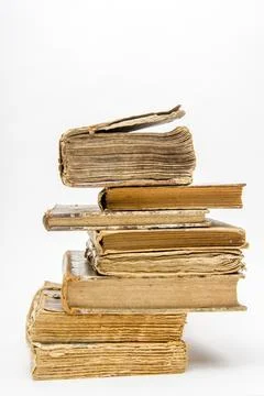 Vertical shot of a stack of old books on an isolated background Stock Photos