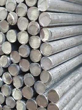 Vertical shot of a stack of round steel bars Stock Photos