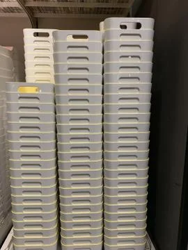 Vertical shot of a stack of storage boxes in a store 写真素材