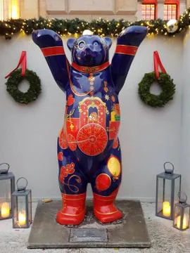 Vertical shot of a statue of a bear designed in Christmas patterns Stock Photos