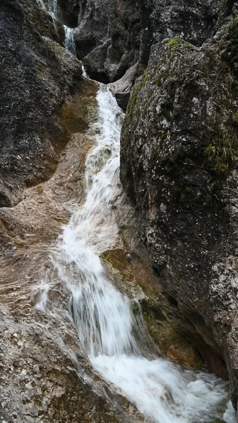 Vertical shot of a stepped waterfall in autumn, autumn colors Stock-Footage 260894471