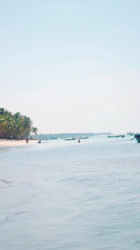 Vertical shot of Summer vacation beach background with small ocean waves crashin Stock Footage 285843731