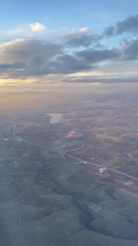 Vertical shot of sunset over Turkey crops view from plane window Stock Footage 277289440