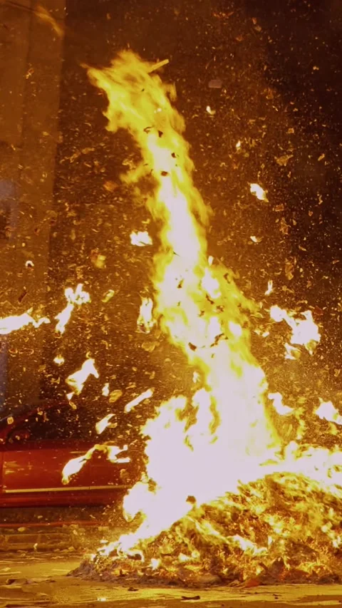 Vertical Shot of Swirling Fire Vortex and Airborne Paper Flakes Vídeo Stock 345994539