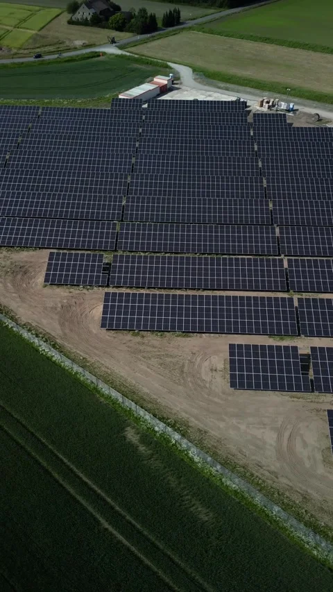 A vertical shot taken from above using a drone, showing solar panels. 動画素材 277208642