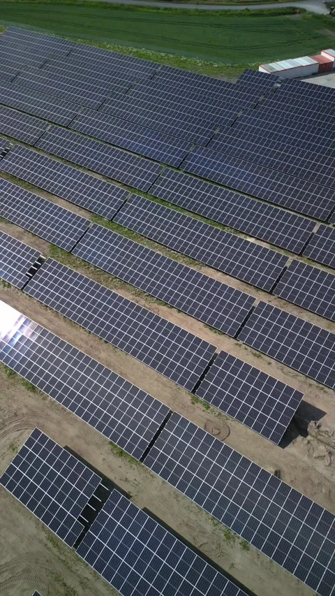 A vertical shot taken from above using a drone, showing solar panels. Stock-Footage 277208745