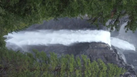 Vertical shot: thunderous Lower Yosemite Falls during Spring 2023 snowmelt Stock Footage 241194071