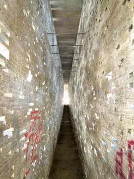 A vertical shot of a tunnel full of rectangular light holes in Granada, Andal Foto stock
