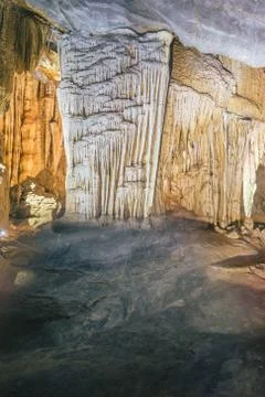 A vertical shot of unique cave formations on a cave wall in Paradise Cave, Vi Stock Photos