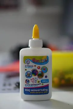 Vertical shot of Universal glue Creativo brand on blur background Stock Photos