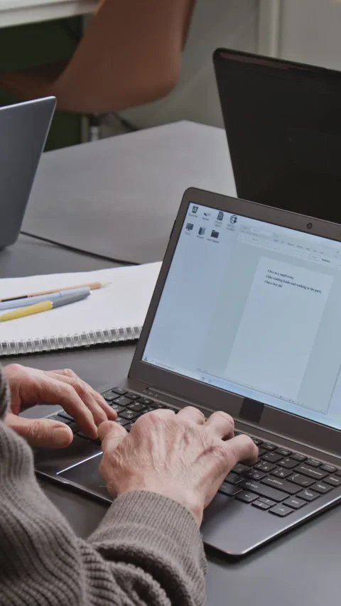 Vertical Shot of Unrecognizable Man Typing Text in Computer Literacy Class Stock Footage 333708570
