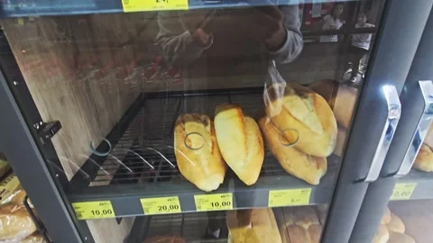 A vertical shot of various types of bread and buns in a supermarket Stock Footage 277116714