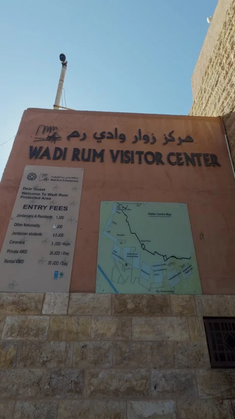 Vertical shot of Wadi Rum Visitor Center sign with entry fees and route map in Stock Footage 328616558