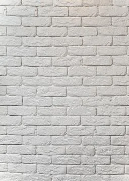 Vertical shot of a wall with white rectangular bricks Stock Photos