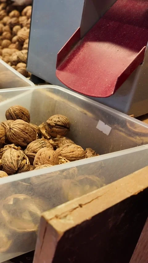 Vertical Shot of Walnut Cracking Machine in Nut Shop 스톡 동영상 332231750