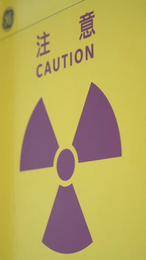 Vertical shot: Warning sign on radioactive medical equipment. Stock Footage 312643638