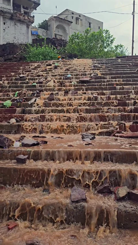 Vertical Shot of Water Flowing Over Steps at Omkareshwar Stock Footage 341940277