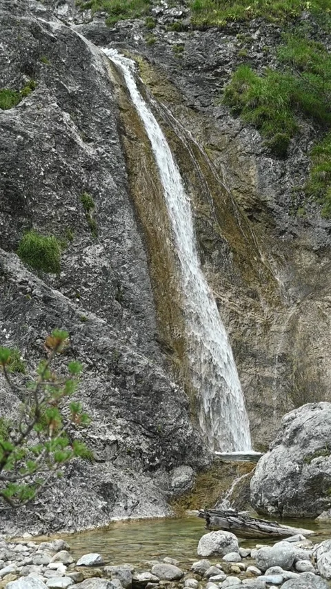 Vertical shot of a waterfall, overcast, slow motion Stock-Footage 260888227