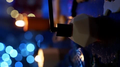 A vertical shot on which a candle is extinguished with a special tool. Stock Footage 265066571