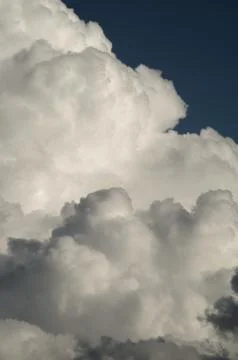 Vertical shot of white clouds gathering in the sky Stock Photos